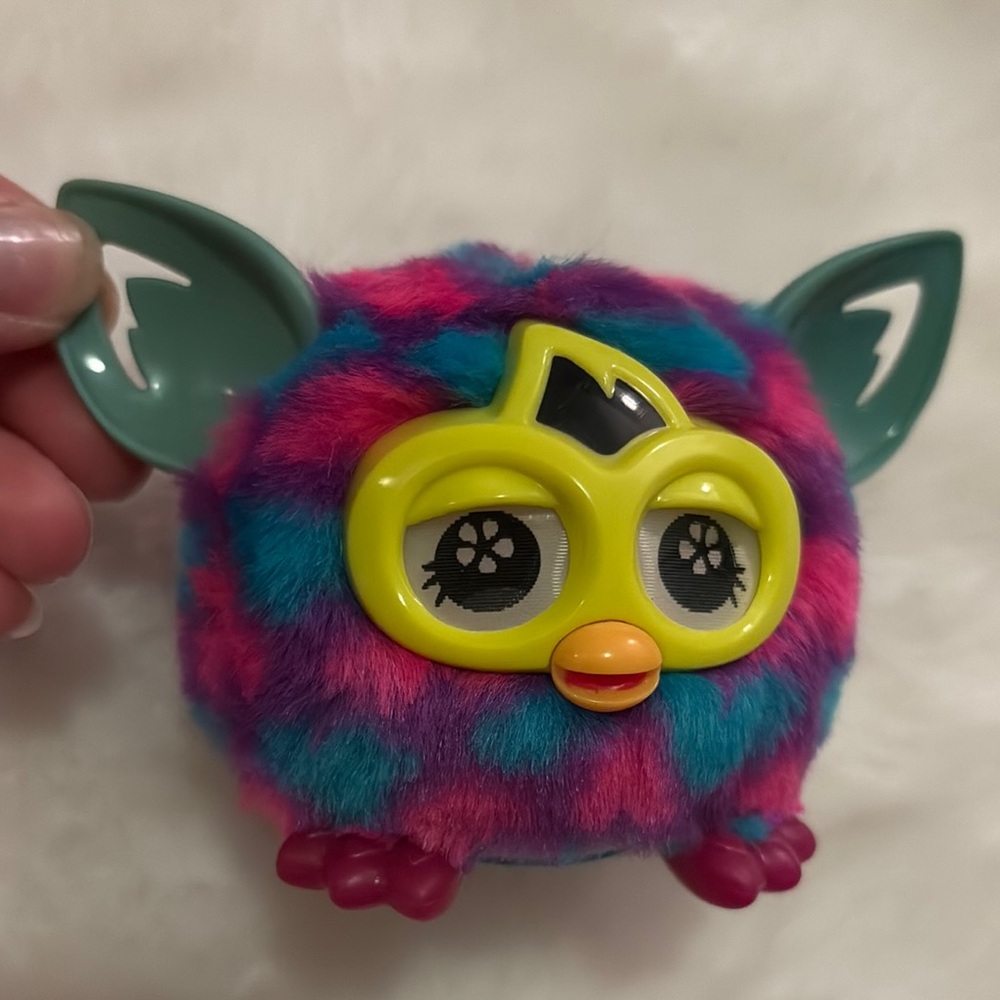 Colorful Plush Toy with Green and Pink Accents